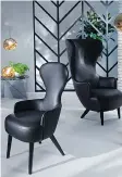  ??  ?? Tom Dixon designed these wingback chairs and melt lights.