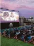  ?? Rooftop Cinema USA ?? Moviegoers enjoy a film al fresco.