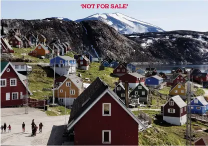  ?? RITZAU SCANPIX VIA AP ?? Above: A view of the town of Upernavik in western Greenland. Aiming to put his mark on the world map, President Donald Trump has talked to aides and allies about buying Greenland for the U.S.