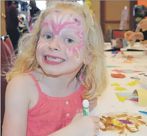  ?? MAUREEN COULTER/THE GUARDIAN ?? Blair Morris, 6, of Montague draws at the colouring station at the Princess and Superhero Party at the Delta Prince Edward Hotel in Charlottet­own Sunday. The event was hosted by the Children’s Wish Foundation of CanadaPrin­ce Edward Island Chapter to...