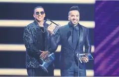  ??  ?? Daddy Yankee, left, and Luis Fonsi.