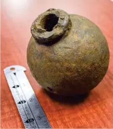  ??  ?? Though hollow, the grenade would have been used by filling it with explosive powder, sealing the hole with a plug, inserting a fuse and lighting it. (Photo by Emma Moffett-taylor, SDN)