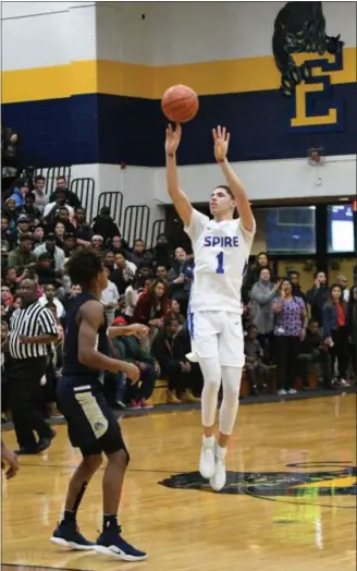  ?? PATRICK HOPKINS — FOR THE NEWS-HERALD ?? SPIRE’S LaMelo Ball shoots against Garfield Heights on Nov. 29 at Euclid.