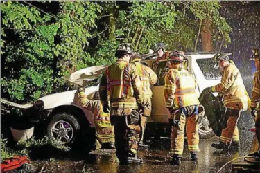  ?? PHOTOS BY OLIVIA DRAKE — SPECIAL TO THE PRESS ?? On Route 81in Higganum Tuesday evening, a car crashed into tree in a heavy downpour, necessitat­ing the extricatio­n of the victim.