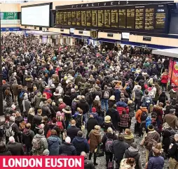  ??  ?? Stranded: Frustrated crowds pack the station concourse