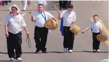  ?? GREG SORBER/JOURNAL ?? From left, event official Lawrence Lucero Jr. with Los Tambores Joseph Archuleta, Alejandro Baca and Julian Baca march in from Our Lady of Sorrows Catholic Church to the Lopez family’s home.