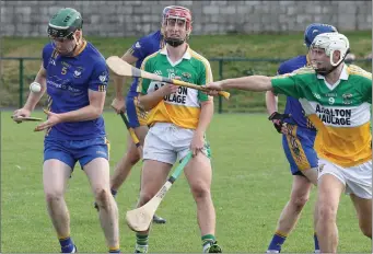  ??  ?? Niall Hughes of Tara Rocks controls the sliothar as Liam Pender (Duffry Rovers) applies pressure.