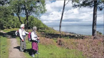  ??  ?? The Arran Coastal Way takes walkers along the island’s well defined and establishe­d pathways, offering spectacula­r sea views.