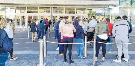  ?? TREVOR FRASER/ORLANDO SENTINEL ?? People line up Friday outside the Dr. Phillips Center for the Performing Arts to buy tickets to the Broadway musical “Hamilton.”