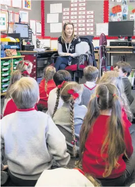  ?? Jane Barlow ?? > Jacqui Milliner teaches her P1 pupils on their first day back at Inverkip Primary School in Inverclyde as Scotland’s youngest pupils return to the classroom as part of a phased reopening of schools