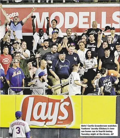  ??  ?? Mets’ Curtis Granderson watches Yankees’ Jacoby Ellsbury’s tworun home run in fourth inning Tuesday night at the Bronx. AP