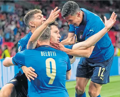  ??  ?? Federico Chiesa takes the plaudits after breaking the deadlock for Italy at Wembley