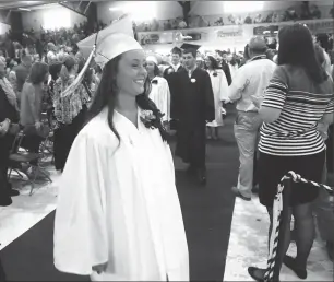  ??  ?? Senior Class President Jillian Cash is applauded as she takes the stage for her Commenceme­nt Address during the school's 116th Commenceme­nt Friday evening.