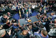  ?? SHEN TING / XINHUA ?? Facebook CEO Mark Zuckerberg is surrounded by members of the media as he arrives to testify before a Senate committee joint hearing regarding the company’s use and protection of user data, in Washington, on Tuesday.