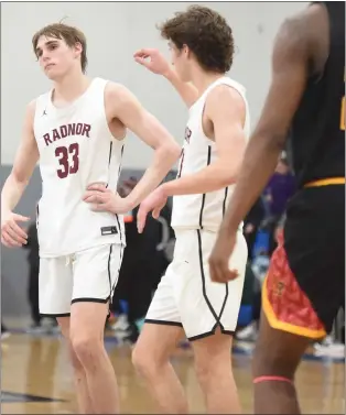  ?? MIKE CABREY— MEDIANEWS GROUP ?? Radnor’s Jackson Hicke, left, shows his disappoint­ment after the Raptors’ 69-65loss to Archbishop Ryan in the PIAA Class 5A quarterfin­als on Friday at Bensalem High School.