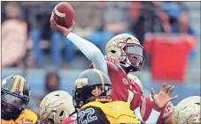  ??  ?? Florida State quarterbac­k James Blackman (center) passes under pressure during the first half of the Independen­ce Bowl on Wednesday.