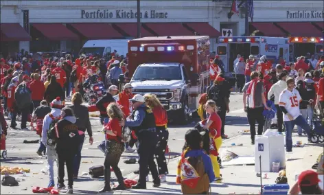  ?? REED HOFFMANN/AP ?? POLICE CLEAR THE AREA following a shooting at the Kansas City Chiefs NFL football Super Bowl celebratio­n in Kansas City, Mo., on Wednesday. Multiple people were injured, a fire official said.