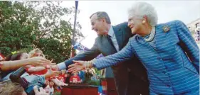  ?? — AFP ?? Bush and first lady Barbara Bush with the crowd in this file photo taken on March 6, 1992.