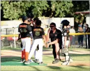  ?? RECORDER PHOTO BY NAYIRAH DOSU ?? A Portervill­e All-stars coach pays a visit to the mound during the first inning of the 10u Little League California District 34 Championsh­ip game against Visalia, Thursday, June 27, 2019, at Divisadero Middle School in Visalia.