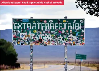  ??  ?? Alien landscape: Road sign outside Rachel, Nevada