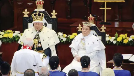  ??  ?? royal couple: A priest reading to the newly crowned King Tupou VI and Queen Nanasipau’u at the Centenary Church in Nuku’alofa after their coronation. — AP