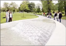  ??  ?? In this May 6, 2005 file photo, members of the public visit the ‘Diana, Princess of Wales Memorial Fountain’, which was re-opened following four
months of repairs, in London’s Hyde Park. (AP)