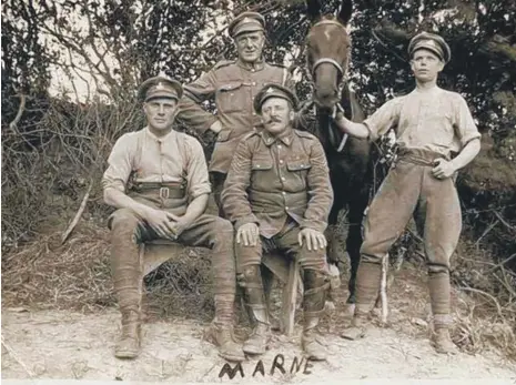  ??  ?? Sgt George Thompson, standing at the back, in a field in Marne.