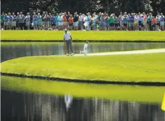  ?? Matt Slocum / Associated Press 2019 ?? Dustin Johnson and son Tatum on the ninth green at the Masters’ Par 3 Contest. The Par 3 and the galleries are canceled this year.