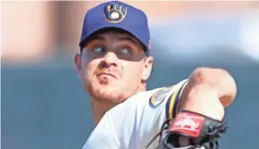  ?? ROY DABNER/FOR THE MILWAUKEE JOURNAL SENTINEL ?? Brewers non-roster invitee Justin Grimm (shown in earlier spring training) pitched in Wednesday's situationa­l scrimmage and has made an impression on manager Craig Counsell.