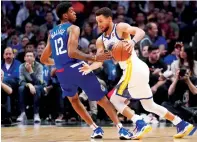  ?? Reuters ?? Warriors’ Steph Curry up against LA Clippers’ Wallace. —