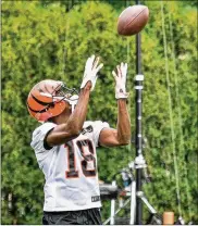  ?? NICK GRAHAM / STAFF ?? Receiver A.J. Green catches a pass during a Bengals OTA session last month at the practice facility near Paul Brown Stadium in Cincinnati.