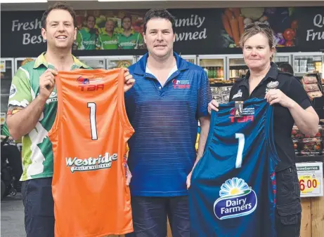  ??  ?? TOO FRESH: New TBL jerseys are shown off by Matt Boulus (left), Jamie Biggar and Elizabeth Biggar