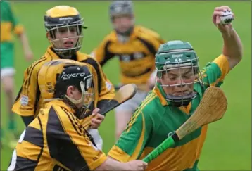  ??  ?? Joseph Rossiter of Blackwater under pressure from Rathnure’s Charlie Mooney.