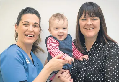  ??  ?? Michelle Carter, Julie Davidson and baby Carys. Julie nominated Michelle for the award of Midwife of the Year after her help over many years.