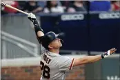  ?? JOHN BAZEMORE – THE ASSOCIATED PRESS ?? The Giants’ Buster Posey watches his two-run home run during the first inning against the Atlanta Braves on Friday.