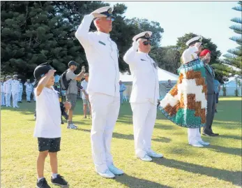  ??  ?? Five-year-old Connor Petersen-Hodge joined Warrant Officers Joseph Gray (left) and Pete Johnson, Rear Admiral David Proctor and ex-serviceman Hirini Henare in saluting Navy sailors as they marched from the parade ground . . .