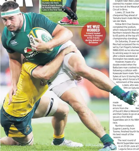  ??  ?? WE WUZ ROBBED Ireland hooker Herring is stopped in his tracks during defeat in Brisbane