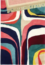  ?? ?? Safi spot rug, €180 from Littlewood­s Ireland
Multi-colour wavy striped rug, €160 from HomeSense