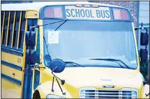  ??  ?? This Wi-Fi-enabled school bus, seen at an apartment complex on March 27, 2020, in Winnsboro, SC, is one of many being sent to rural and lowerincom­e areas around South Carolina to help students with distance learning during the new coronaviru­s outbreak. (AP)