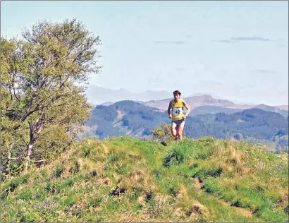  ??  ?? A participan­t running in the sunshine on a hilltop near Tayvallich during last year’s event.