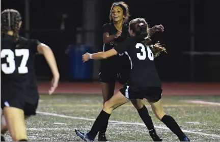  ?? AUSTIN HERTZOG — MEDIANEWS GROUP ?? Pennridge’s Leah Malone, facing, is congratula­ted after scoring her team’s second goal against Spring-Ford in the District 1 championsh­ip game.