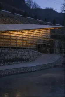  ??  ?? Glass, timber and rock combine in LUO studio’s dramatic Natural Library for Zheshui Village in Shanxi province, which was built into the rock face using traditiona­l constructi­on methods