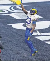  ?? STEVEN BISIG/ USA TODAY SPORTS ?? Rams running back Cam Akers celebrates after scoring a TD on a 5- yard run in the win Saturday against the Seahawks. He rushed for 131 yards.