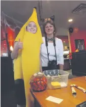  ??  ?? SCRAPS volunteer ‘banana’ with volunteer Anne Marciszyn at the Scaredy Cat Fundraiser.
