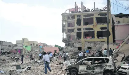  ?? Mohamed Abdiwahab / AFP ?? At least 28 people were killed in an Al Shabab bomb and gunfire attack at a Mogadishu hotel.