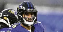  ?? TERRANCE WILLIAMS / AP Contributi­ng Writer ?? Baltimore Ravens safety Geno Stone looks on during warmups before a game a Jan. 6. Stone signed with the Bengals this offseason after four seasons with the Ravens.