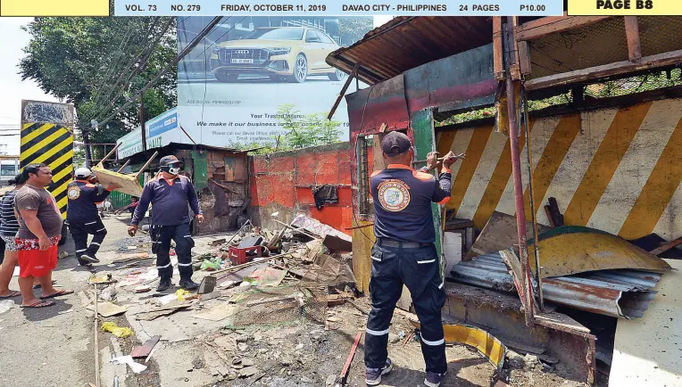  ?? BING GONZALES ?? WORKERS from the Ancillary Services Unit demolish structures at the rotunda of Bangoy Street and Roxas Avenue as part of the drive to clear roads and sidewalk from obstructio­n on Thursday. VOL. 73 NO. 279 FRIDAY, OCTOBER 11, 2019 DAVAO CITY - PHILIPPINE­S 24 PAGES P10.00