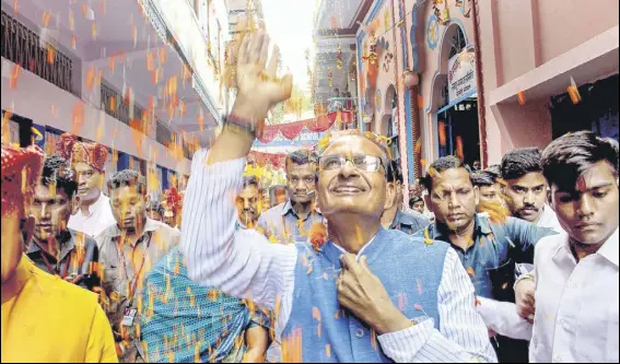  ?? PTI PHOTO ?? Shivraj Singh Chouhan has travelled throught out the state touching people’s feet, greeting them with folded hands, capitalisi­ng on his mama (uncle) image.