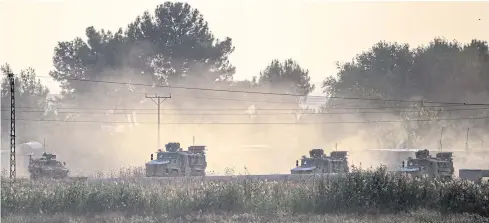  ?? AFP ?? Turkish army vehicles drive towards the Syrian border near Akcakale in Sanliurfa province on Wednesday.