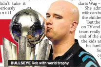  ??  ?? BULLSEYE Rob with world trophy